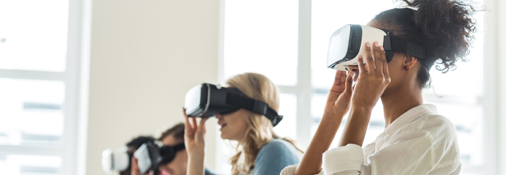 College students wearing VR headsets