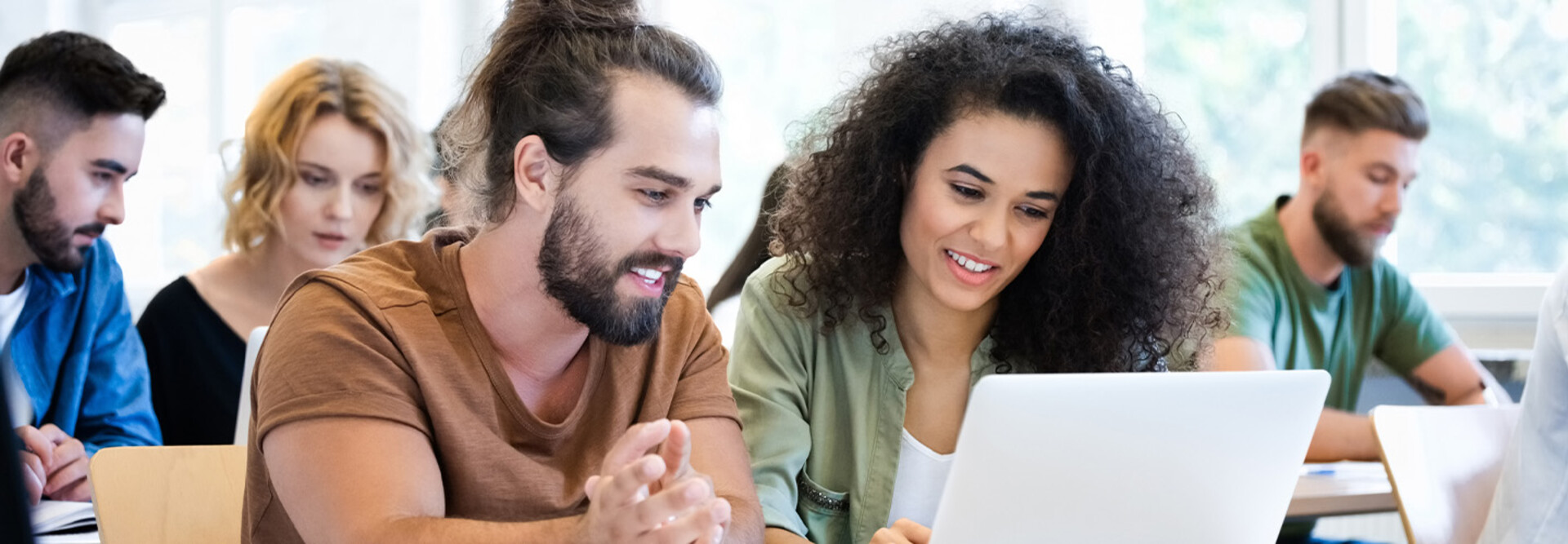 Students collaborating with tech