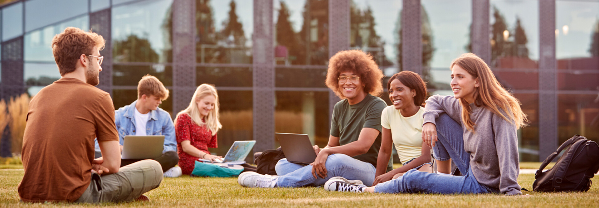Students using device on quad