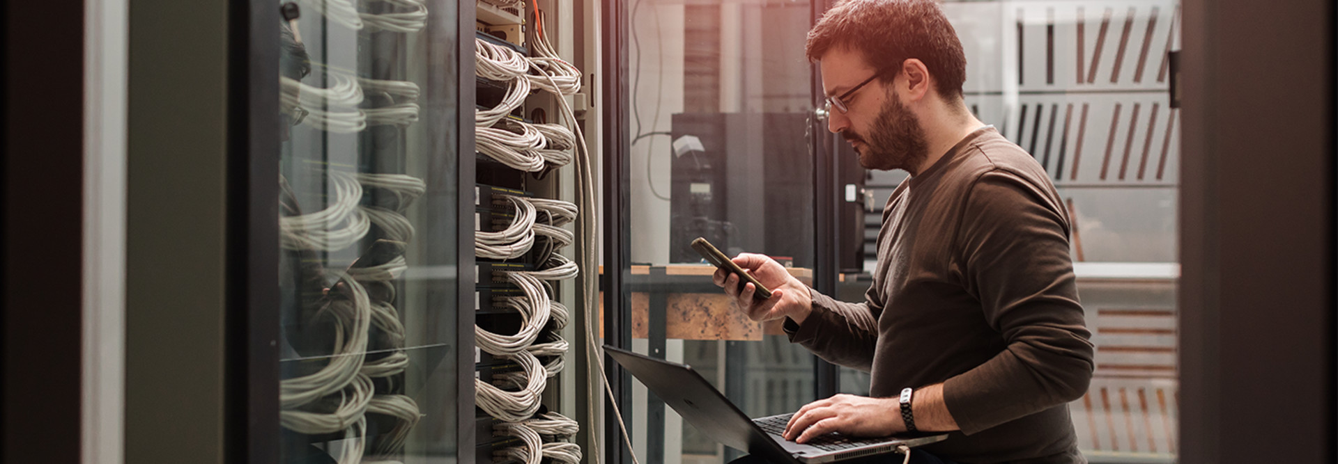 Guy working on data center