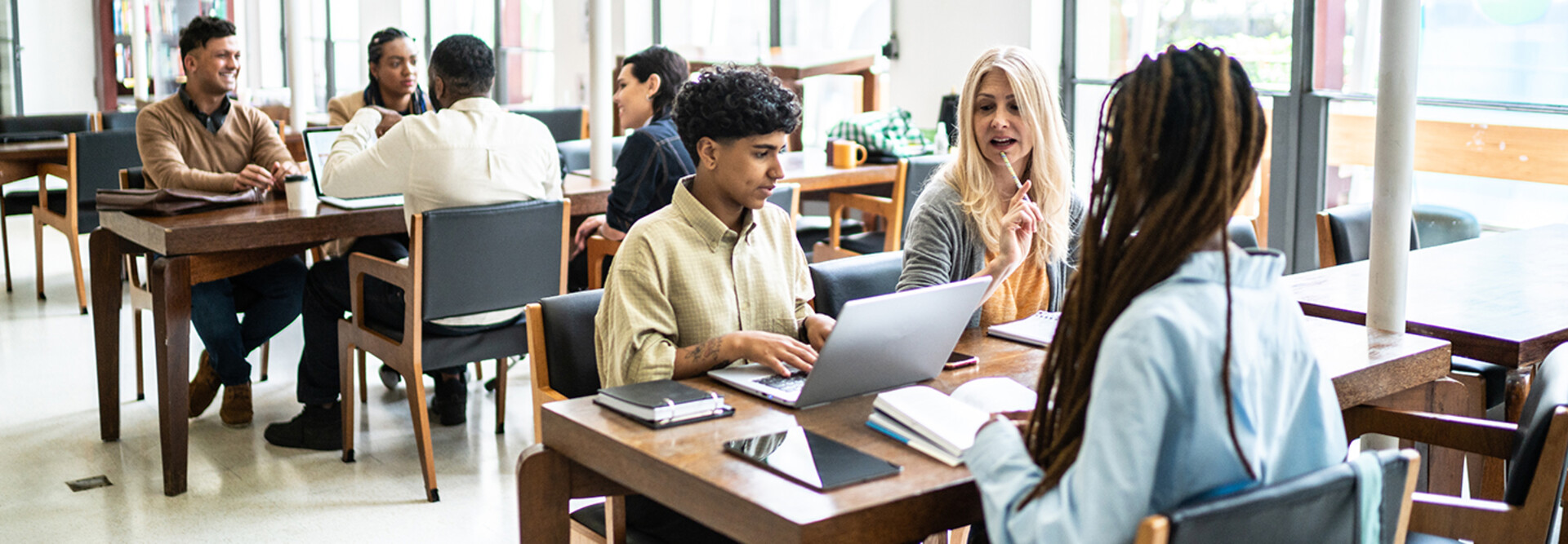 Students working at tables together