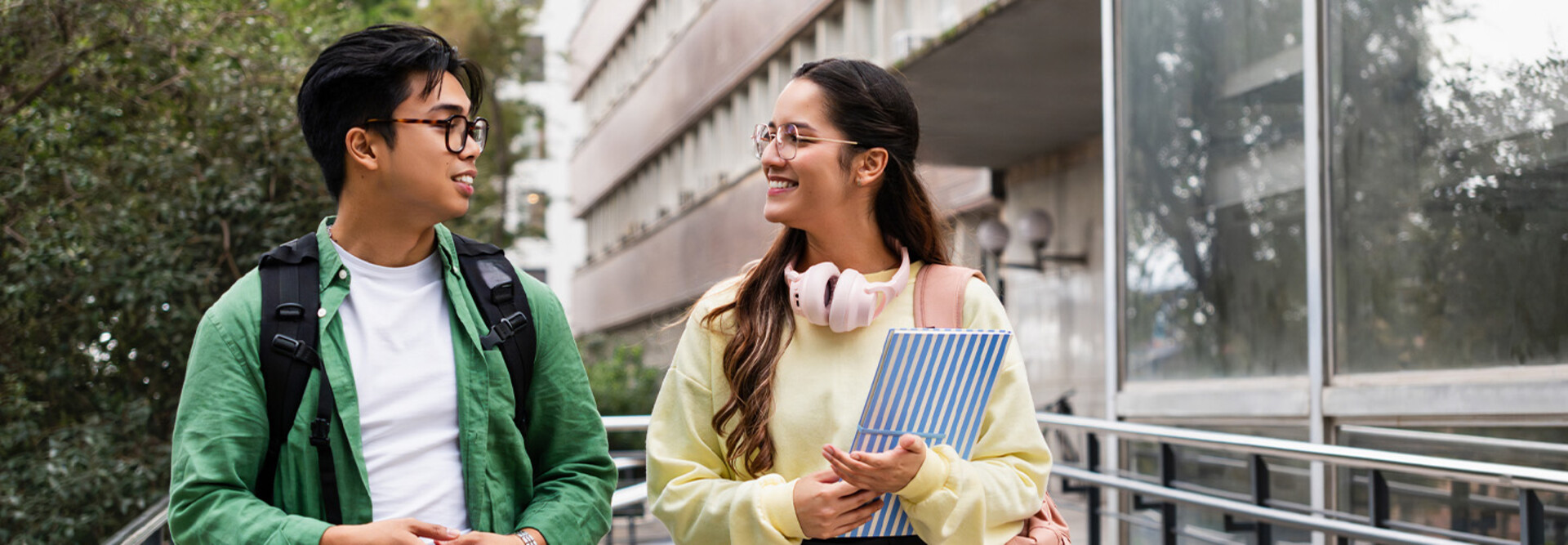 Student friends walking with books