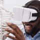 Black man using VR in his STEM studies at an HBCU