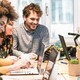 Students work together around a table
