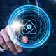 Person pressing illustrated atom