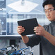 Student Holding Tablet and Controlling Robot Hand Moving at Different Ways At University Class