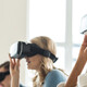 College students wearing VR headsets