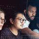 People working on computer together 