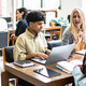 Students working at tables together