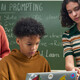 Students using computer in class