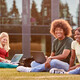 Students using device on quad