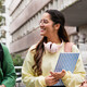 Student friends walking with books