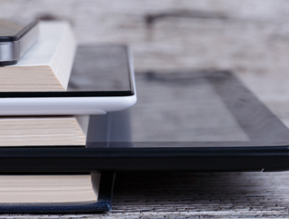 Books and tablets stacked