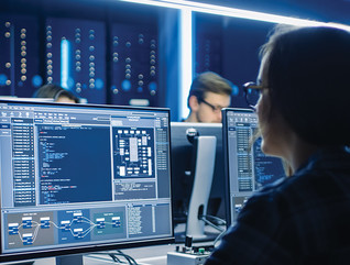 Woman at security monitors