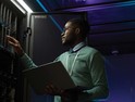 Black man working on a data center