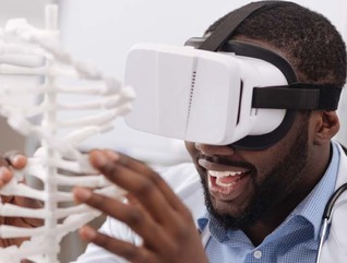 Black man using VR in his STEM studies at an HBCU