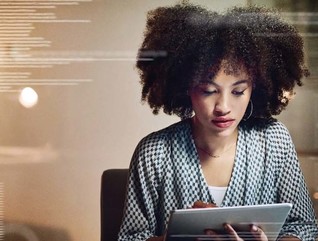 A woman works at a tablet