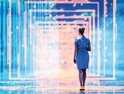 Abstract image of woman walking through technology