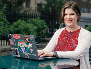 Patricia Clay uses her desktop at an outdoor table