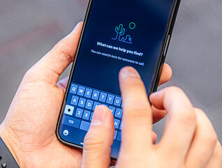 Person using mobile device at Alexandria Tech 