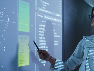 Person reviewing data in meeting