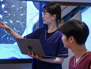 Health care professionals looking at medical x-rays