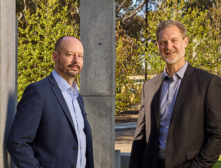 Daniel Suchy and Brett Pollak pose for a photo at the University of California, San Diego