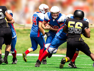 College students playing football