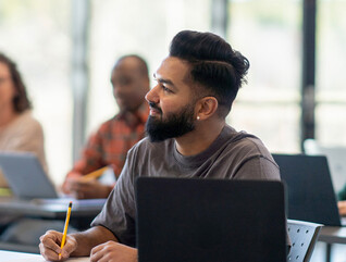 Person listening to lecture in classroom