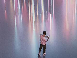 Person walking with phone and headphones