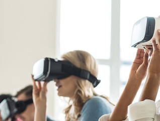 College students wearing VR headsets