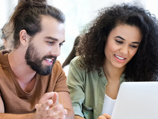 Students collaborating with tech