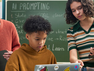 Students using computer in class