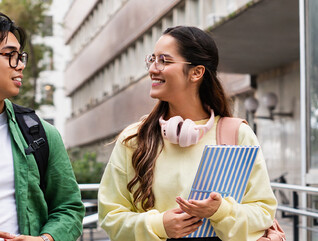 Student friends walking with books