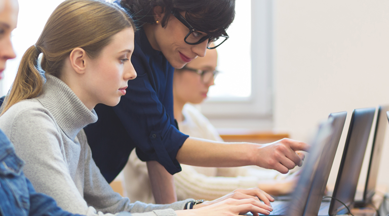 Woman teaching cybersecurity on computer