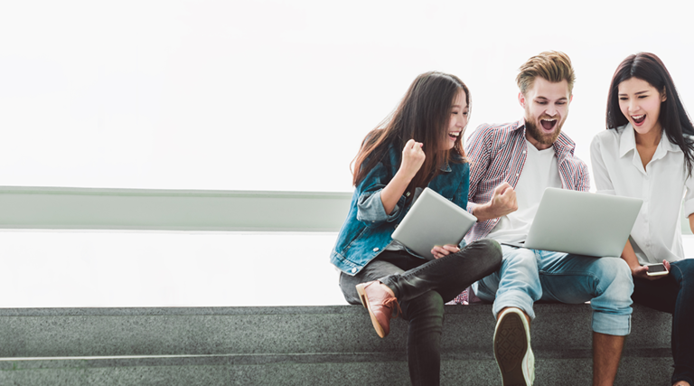 College Students excited about laptop