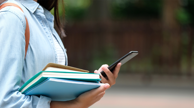 College kid with phone