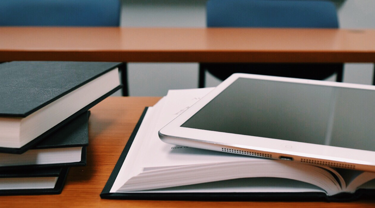 iPad on top of book