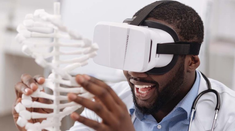 Black man using VR in his STEM studies at an HBCU