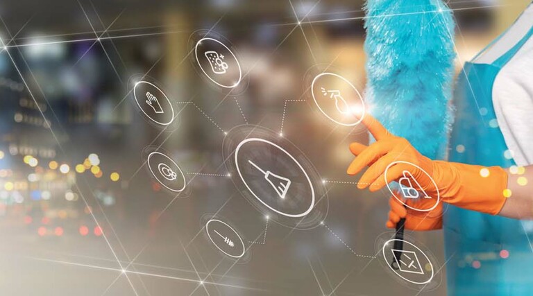 A woman holding a feather duster is superimposed behind a tranparent touch screen display
