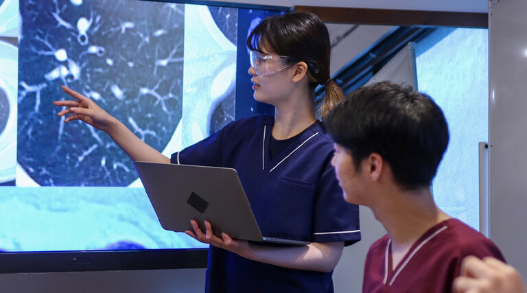 Health care professionals looking at medical x-rays