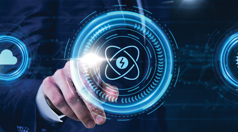 Person pressing illustrated atom