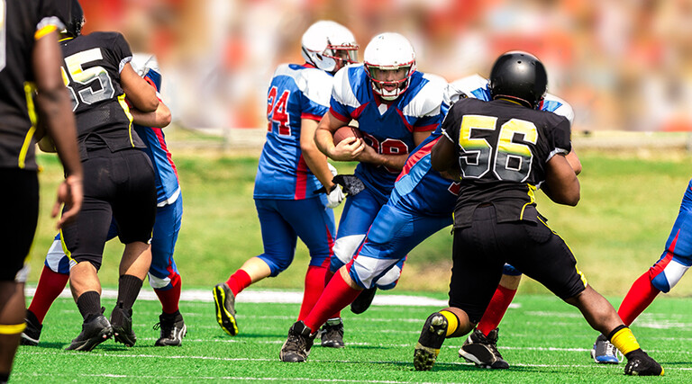 College students playing football