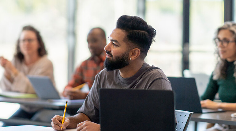 Person listening to lecture in classroom