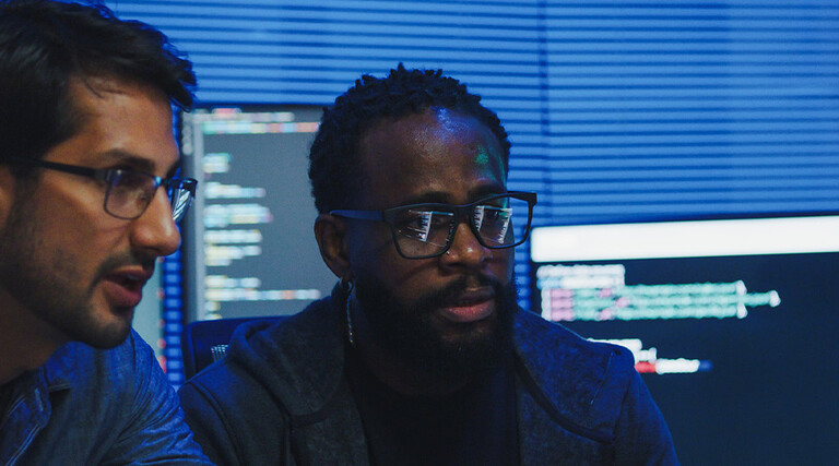 Co-workers reviewing code