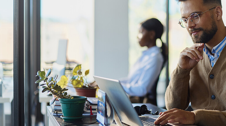 Man working on a computer in an office