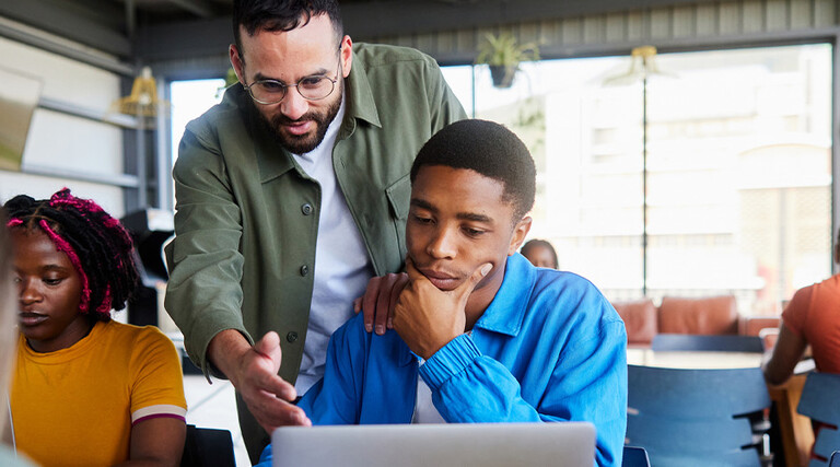 Professor helping students