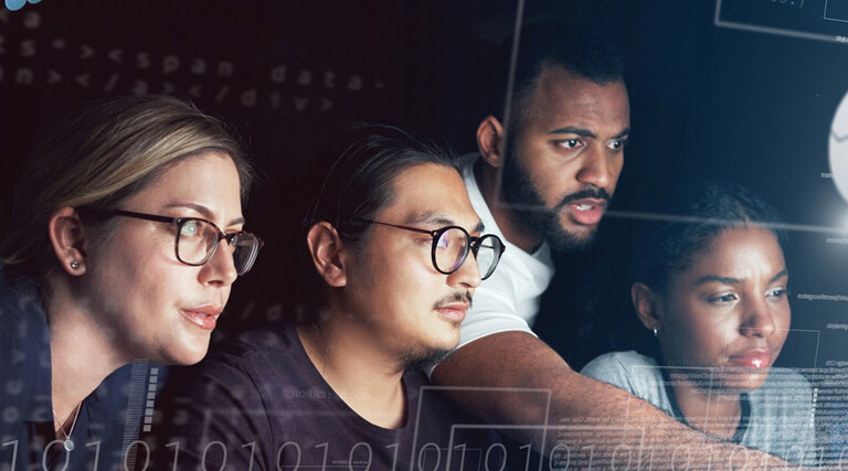 People working on computer together 