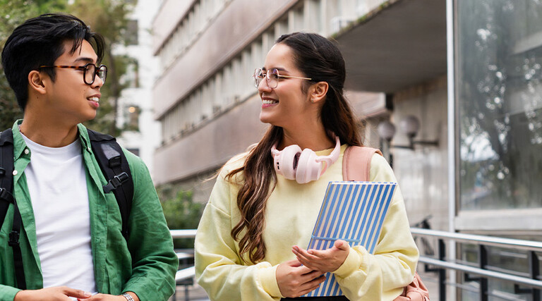 Student friends walking with books