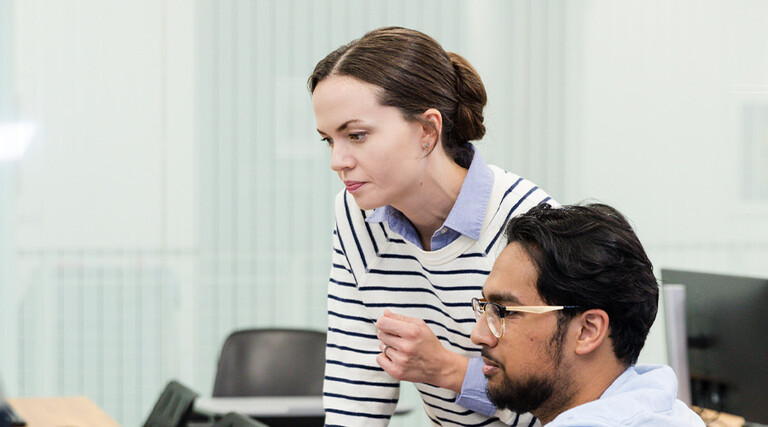 IT team looking at computer